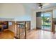 Open living area with hardwood floors, natural light, and a sliding glass door leading to the backyard at 4664 S Zang St, Morrison, CO 80465