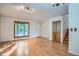 Bright living room with hardwood floors, a bay window, and stairs at 4664 S Zang St, Morrison, CO 80465