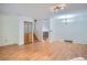 Spacious living room featuring hardwood floors, stairs, and ample natural light at 4664 S Zang St, Morrison, CO 80465
