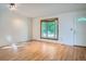 Inviting living room with bay window offering abundant natural light and hardwood floors at 4664 S Zang St, Morrison, CO 80465