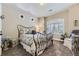 Guest bedroom with an iron bed frame and window seat at 1505 Raindrop Way, Castle Rock, CO 80109