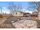 Wide-angle view of the backyard and back exterior of this home at 4499 E Colorado Ave, Denver, CO 80222