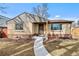 Charming home featuring brick accents and a welcoming entrance with a concrete walkway at 4499 E Colorado Ave, Denver, CO 80222