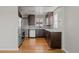 Modern kitchen with stainless steel appliances, hardwood floors, and ample counter space at 4499 E Colorado Ave, Denver, CO 80222