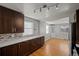 Open kitchen features wood floors, granite counters, and modern cabinetry at 4499 E Colorado Ave, Denver, CO 80222