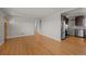 Spacious living room featuring stainless steel appliances, hardwood floors, and neutral walls at 4499 E Colorado Ave, Denver, CO 80222