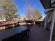 Back deck with a dining table and chairs plus outdoor grills and partial backyard view at 9889 Aftonwood St, Highlands Ranch, CO 80126