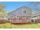 Backyard featuring a well-maintained lawn, and a deck perfect for outdoor relaxation at 9889 Aftonwood St, Highlands Ranch, CO 80126