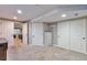 Finished basement with carpet, two doors, and a closet at 9889 Aftonwood St, Highlands Ranch, CO 80126