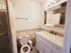 Bright bathroom featuring mosaic tile accents, a vanity with storage, and a glass-enclosed shower at 9889 Aftonwood St, Highlands Ranch, CO 80126