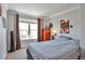 Bedroom with natural light and neutral paint at 9889 Aftonwood St, Highlands Ranch, CO 80126
