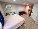 Finished basement bedroom with desk, closet, and ample storage space at 9889 Aftonwood St, Highlands Ranch, CO 80126