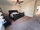 Spacious bedroom with neutral carpet, a ceiling fan, and ample closet space for storage at 9889 Aftonwood St, Highlands Ranch, CO 80126