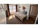 Cozy bedroom features neutral carpet, ample natural light, and a large window at 9889 Aftonwood St, Highlands Ranch, CO 80126