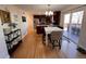 Modern kitchen with stainless steel appliances, granite countertops, and access to a backyard deck at 9889 Aftonwood St, Highlands Ranch, CO 80126