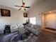 Comfortable living room with neutral decor, vaulted ceiling, and plenty of space for relaxing and entertaining at 9889 Aftonwood St, Highlands Ranch, CO 80126