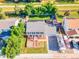 Aerial view of a home highlighting its large backyard, patio, trampoline, and RV parking on a spacious driveway at 12234 W Saratoga Ave, Morrison, CO 80465