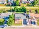 Aerial view showcases the home's large driveway with RV parking and a spacious, well-maintained lawn at 12234 W Saratoga Ave, Morrison, CO 80465