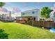 Fenced backyard featuring a lawn, patio, and mature trees providing ample shade at 12234 W Saratoga Ave, Morrison, CO 80465