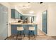 Well-lit kitchen with a center island, modern appliances, and ample counter space at 12234 W Saratoga Ave, Morrison, CO 80465