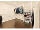 Bright laundry room with modern appliances, built-in shelves, and ample storage space at 12234 W Saratoga Ave, Morrison, CO 80465