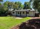 Well-maintained backyard with lush green grass, a patio, and tasteful landscaping at 2836 S Fenton St, Denver, CO 80227