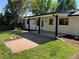 A landscaped backyard with a patio and an expansive grassy area at 2836 S Fenton St, Denver, CO 80227