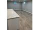 Open basement space featuring light vinyl flooring and light grey walls at 2836 S Fenton St, Denver, CO 80227