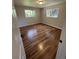 Bedroom with hardwood floors and two windows offering natural light at 2836 S Fenton St, Denver, CO 80227