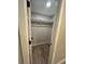This is a walk-in closet with carpet flooring, shelving, and a door that provides privacy at 2836 S Fenton St, Denver, CO 80227