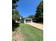 Exterior of home with grass yard, driveway, and attached garage at 2836 S Fenton St, Denver, CO 80227