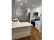 Bright kitchen with white cabinets, stainless steel appliances, and sleek countertops at 2836 S Fenton St, Denver, CO 80227