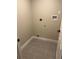 Tiled laundry room complete with hookups and tile floors at 2836 S Fenton St, Denver, CO 80227