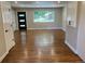 Open living area with refinished floors, updated trim and fixtures and large window at 2836 S Fenton St, Denver, CO 80227
