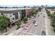 Street view showing businesses and shops with city skyline in the background at 474 N Inca St, Denver, CO 80204