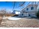 Large backyard area with a patio, gravel, and a wooden fence at 4931 S Danube St, Aurora, CO 80015