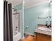 Bathroom featuring a shower and tub combination and decorative tile at 4931 S Danube St, Aurora, CO 80015