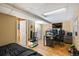 Finished basement bedroom with gaming setup, tv, and hardwood floor at 4931 S Danube St, Aurora, CO 80015