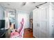 Bedroom featuring hardwood floors, a ceiling fan, and a closet at 4931 S Danube St, Aurora, CO 80015