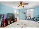 This bedroom offers natural light and an overhead fan fixture at 4931 S Danube St, Aurora, CO 80015