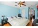 Serene bedroom with light blue walls, hardwood floors, and comfortable furnishings, creating a peaceful retreat at 4931 S Danube St, Aurora, CO 80015