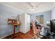 This bedroom features a ceiling fan, a closet and hardwood floors at 4931 S Danube St, Aurora, CO 80015