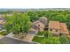 Scenic aerial shot of a charming home surrounded by lush greenery and mature trees at 10222 W Ida Ave # 237, Littleton, CO 80127