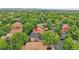Aerial view of a property nestled among lush trees, highlighting its prime location at 10222 W Ida Ave # 237, Littleton, CO 80127