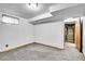 Spacious carpeted basement with natural light and easy access to utilities at 10222 W Ida Ave # 237, Littleton, CO 80127