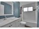 Well-lit bathroom with a white vanity, large mirror, and bath/shower combination at 10222 W Ida Ave # 237, Littleton, CO 80127