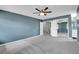 Comfortable bedroom with plush carpet and mirrored closet doors, offering ample storage at 10222 W Ida Ave # 237, Littleton, CO 80127