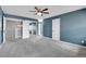 Spacious bedroom featuring a ceiling fan and mirrored closet doors, perfect for comfortable living at 10222 W Ida Ave # 237, Littleton, CO 80127