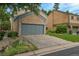 Well-maintained home with a two-car garage and landscaped front yard at 10222 W Ida Ave # 237, Littleton, CO 80127