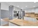 Stylish kitchen with stainless appliances, stone countertops, and updated cabinets at 10222 W Ida Ave # 237, Littleton, CO 80127